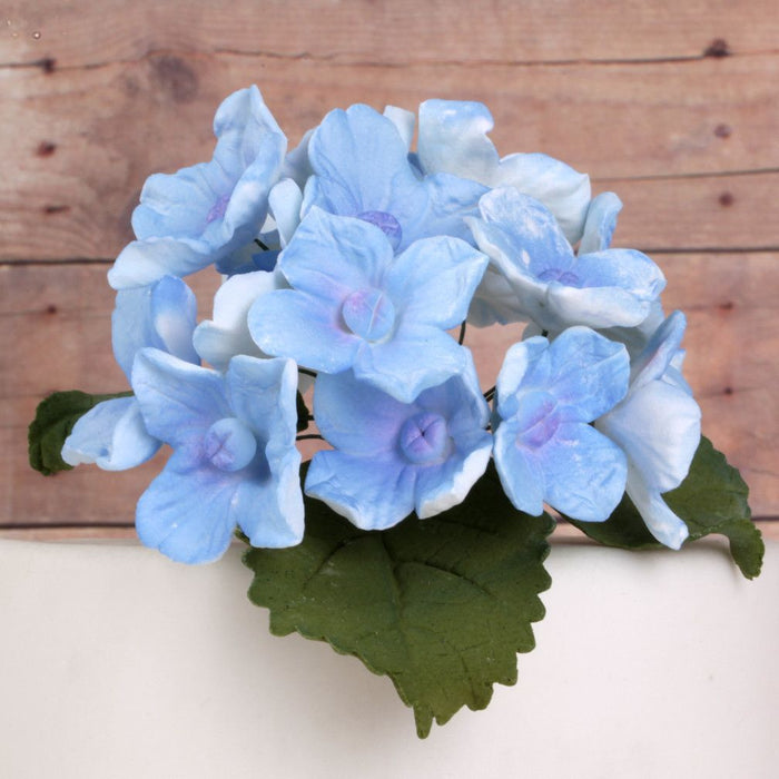 Blue Hydrangeas and Leaves sugarflowers from gumpaste cake decorations perfect for cake decorating fondant cakes as a cake topper.  Wholesale bakery supplies.