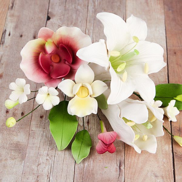 Day Lily & Phalaenopsis Orchids are gumpaste sugarflower cake decorations perfect as cake toppers for cake decorating fondant cakes and wedding cakes. Caljava wholesale cake supply.