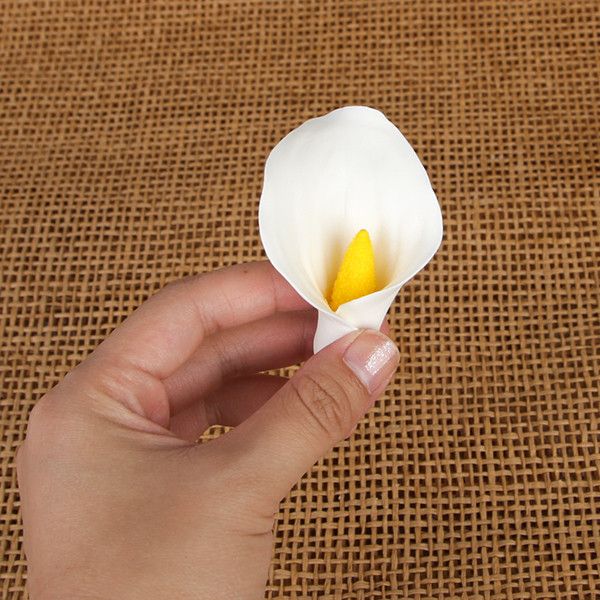 Medium gumpaste calla lily cake decoration perfect as a cake topper for cake decorating rolled fondant wedding cakes and rolled fondant birthday cakes, also works as a great cupcake decoration.