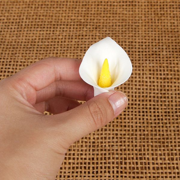 Small gumpaste calla lily cake decoration perfect as a cake topper for cake decorating rolled fondant wedding cakes and rolled fondant birthday cakes, also works as a great cupcake decoration.