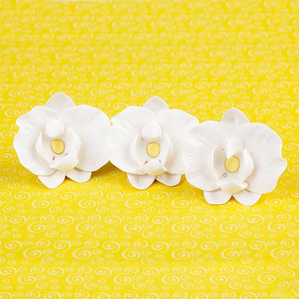 Hawaiian Phalaenopsis Orchids in Light Pink are gumpaste sugarflower cake decorations perfect as cake toppers for cake decorating fondant cakes and wedding cakes. Caljava wholesale cake supply.