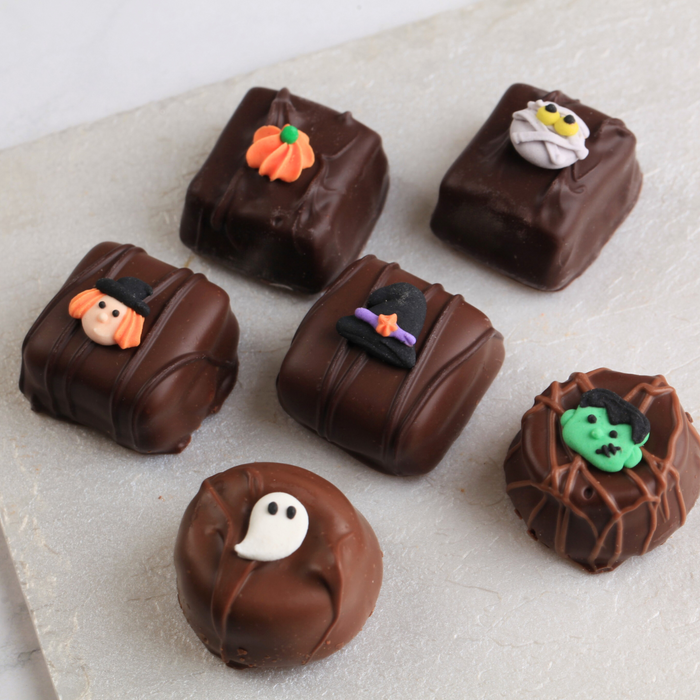 Mini Halloween Edible Royal Icing Toppers great for decorating cupcakes, cookies, cakes, candy and chocolates.  Great for decorating Halloween cakes, cupcakes, cookies, candy and more. Can even be Zombie heads.