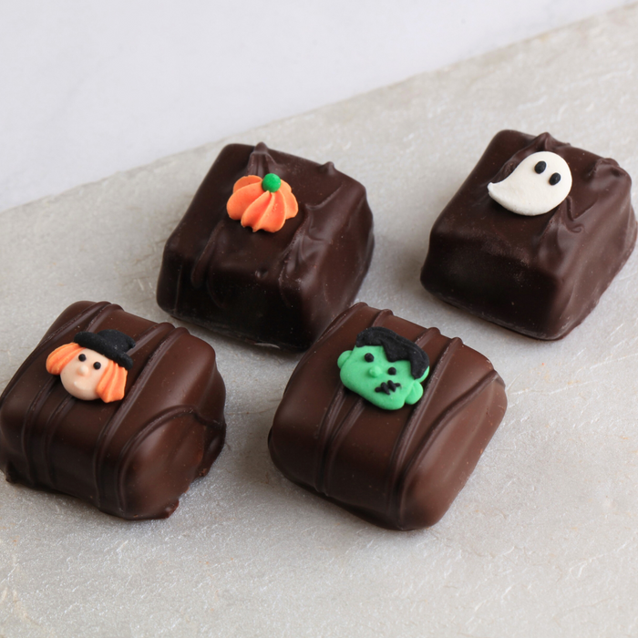 Mini Halloween Edible Royal Icing Toppers great for decorating chocolates, cupcakes, cookies, cakes, candy and pretzles.  Great for decorating Halloween cakes, cupcakes, cookies, candy and more. Can even be Zombie heads.