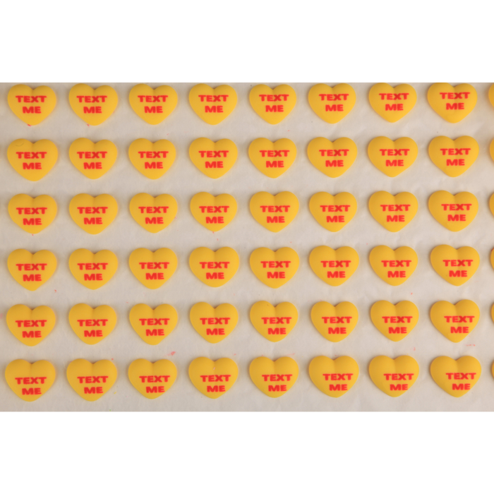 Bulk ready-made royal icing conversation hearts for candy makers and cookie makers to decorate chocolate bars, truffles, and sweets by Caljava