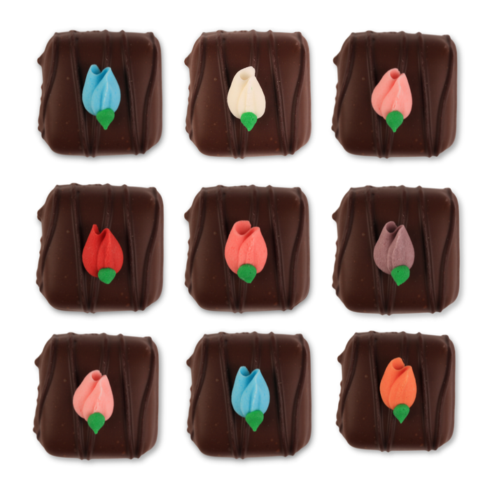 Ready-to-use rosebud royal icing toppers by Caljava for chocolate and candy decorating