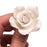 Elegant white hybrid tea rose sugar flower used as a cake accent