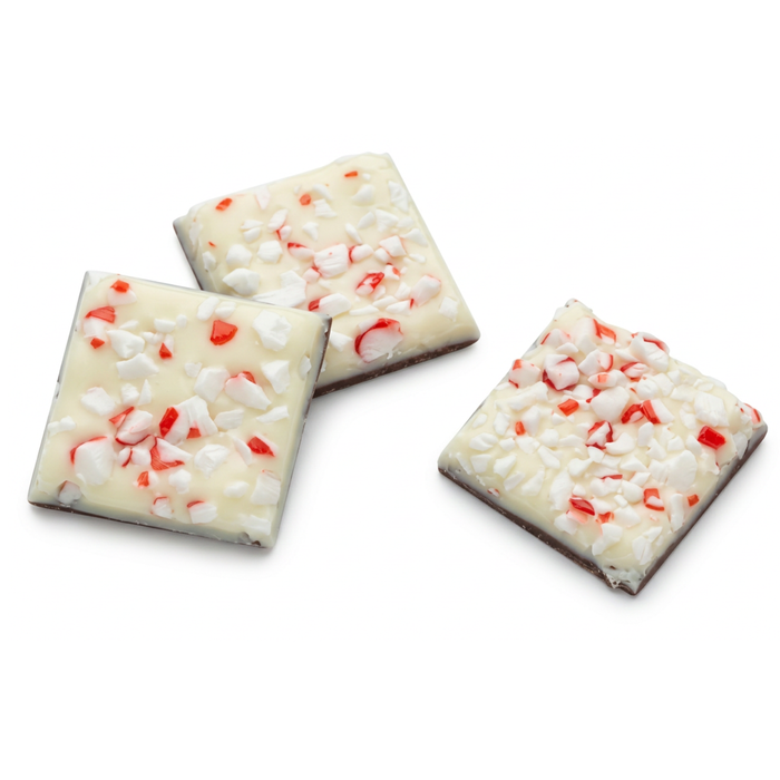 Resale ready 1.25-inch dark and white chocolate peppermint bark squares topped with red peppermint crumble for holiday dessert displays sold in bulk for wholesale