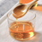 organic blue agave syrup pouring from bottle, natural sugar alternative for baking, candy making and chocolate desserts