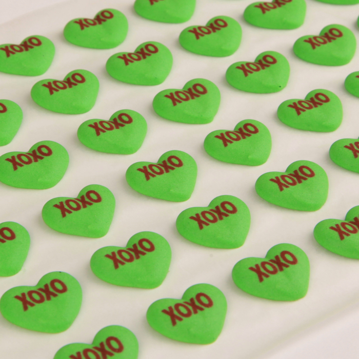 Pre-made royal icing conversation hearts for fast and easy Valentine’s chocolate decorating and candy production