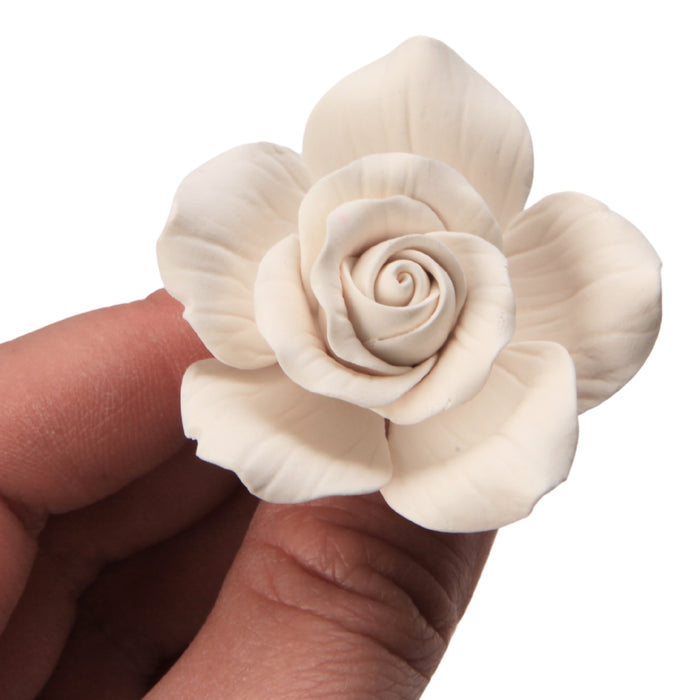 Handcrafted white sugar hybrid tea rose cake topper ready to place on cakes