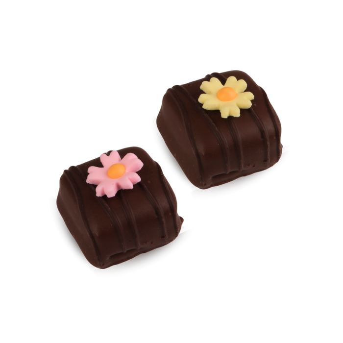 Ready-to-use edible floral cake toppers in assorted fuchsia shades for elegant cake designs