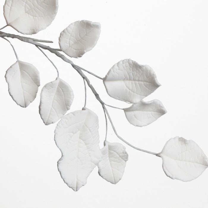Assorted pack of ready-to-use green rose leaf fillers for professional wedding cake decorating.