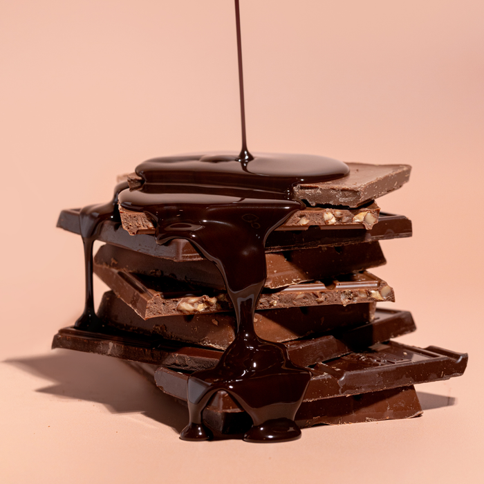 Enrobing cake pops and drizzling pastries using rich Blommer Marquette Gold dark chocolate.