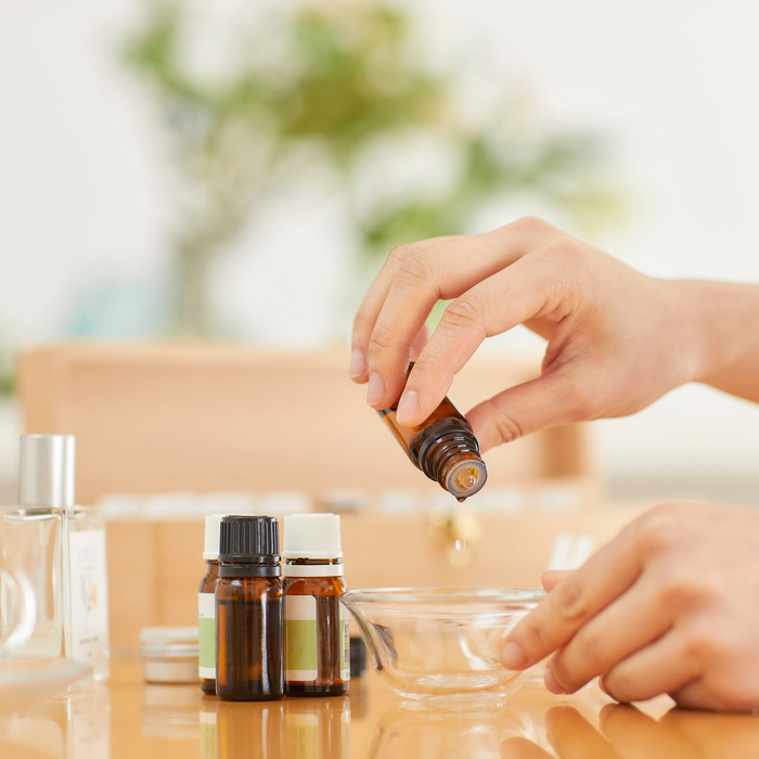 Lightweight Grape Seed Oil poured into hands for smooth, non-greasy massage therapy
