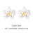 Pair of premade white Phalaenopsis moth orchid sugar flowers side-by-side for tiered cake styling.
