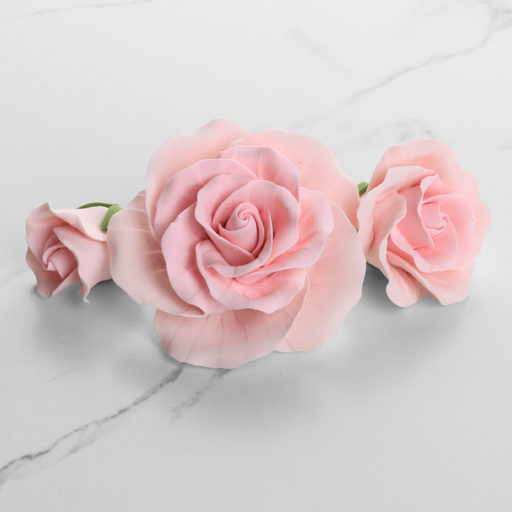 Handcrafted pink garden rose sugar flower cake toppers in assorted sizes for wedding and birthday cakes.