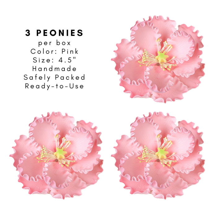 Pink peony gumpaste sugar flower decorating a buttercream cake design