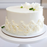 Piping a classic shell border onto a birthday cake using 50Express white buttercream frosting