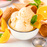 A scoop of bright orange cream dreamsicle ice cream served in a dessert bowl flavor by LorAnn Oils from Caljava
