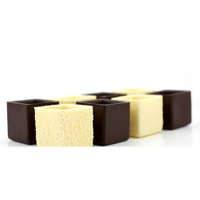 Assortment of pre-made dark and white chocolate textured boxes for high-end desserts and mini cakes