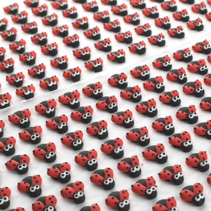 Lady Bug Royal Icing Topper great for decorating your own chocolates, candy, cookies, cake, cupcakes, and more. Hand piped of edible royal icing, safely packed and ready to use out of the box.  Kosher. Caljava