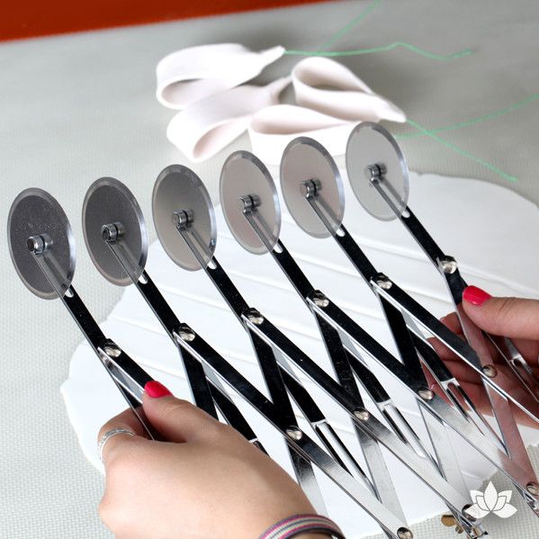 5 Ribbon Fondant Cutter has 6 adjustable blades which cut ribbons up to 5" wide, 5 ribbons at a time. Perfect for cake decorators who make ribbons & loops.