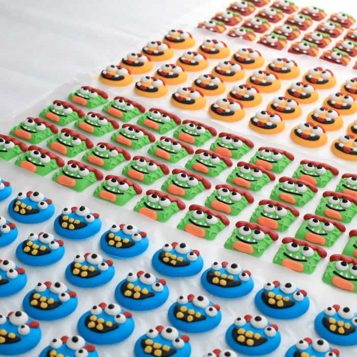 Bulk Commercial Royal Icing Toppers Monster Face Icing Decorations perfect for decorating cakes, cupcakes, cookies, candy and chocolates by Caljava