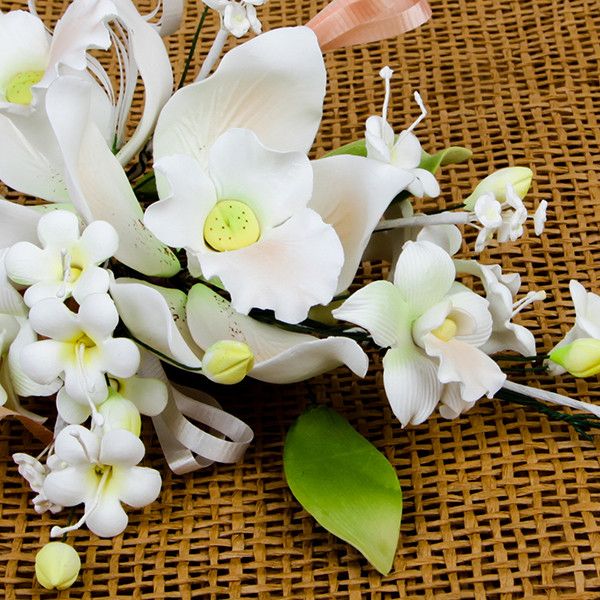 Double Tropical Orchid Sprays in Peach are gumpaste sugarflower cake decorations perfect as cake toppers for cake decorating fondant cakes and wedding cakes. Caljava wholesale cake supply.