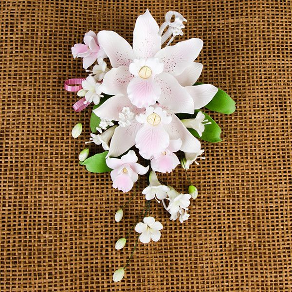 Double Tropical Orchid Sprays in Pink are gumpaste sugarflower cake decorations perfect as cake toppers for cake decorating fondant cakes and wedding cakes. Caljava wholesale cake supply.