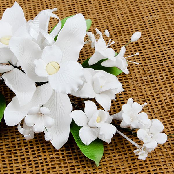 Double Tropical Orchid Sprays in White are gumpaste sugarflower cake decorations perfect as cake toppers for cake decorating fondant cakes and wedding cakes. Caljava wholesale cake supply.
