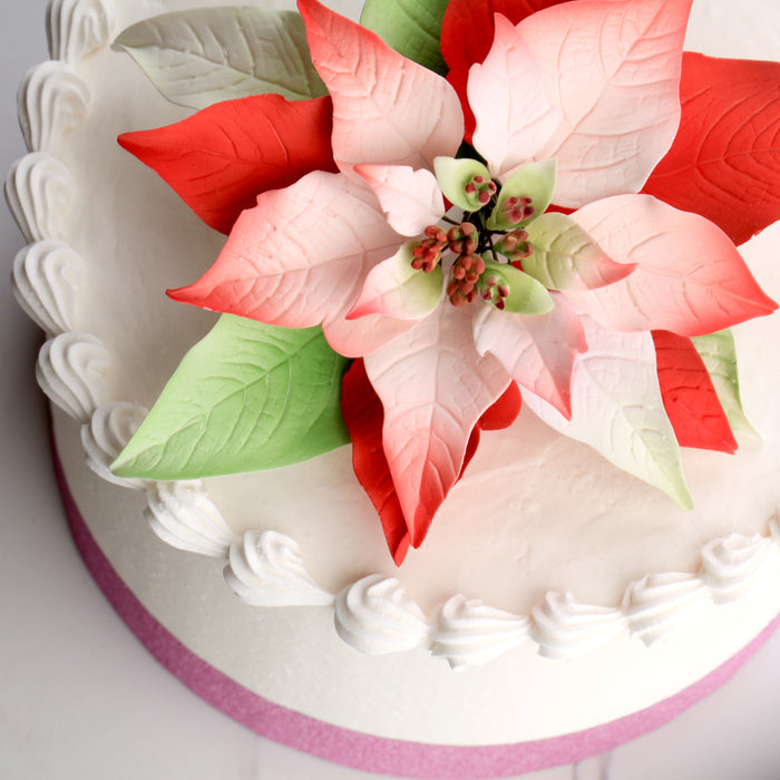 Poinsettia Gum Paste Sugar Flowers great as a cake topper for cake decorating your own holiday cakes. Perfect cake decoration for Christmas cakes and pies.