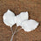 Close-up showing two sizes of green gum paste rose leaves with dimensions 2.5x1.75 inches and 1.5x1.25 inches with flexible wire stems. Wholesale cake supply by Caljava