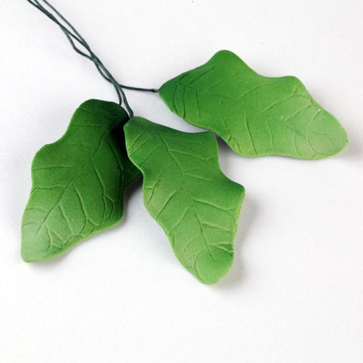 Green Holly Leaf Sugarflower made from gumpaste perfect for cake decorating Christmas cakes & cupcakes & other holiday cakes.  Wholesale cake decorations.