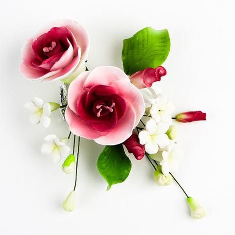 The Mauve Dog Rose Spray Sugar Flower Topper is a ready-to-use, handcrafted gumpaste arrangement designed specifically for professional bakeries, cake decorators, and home business owners looking to scale their operations efficiently