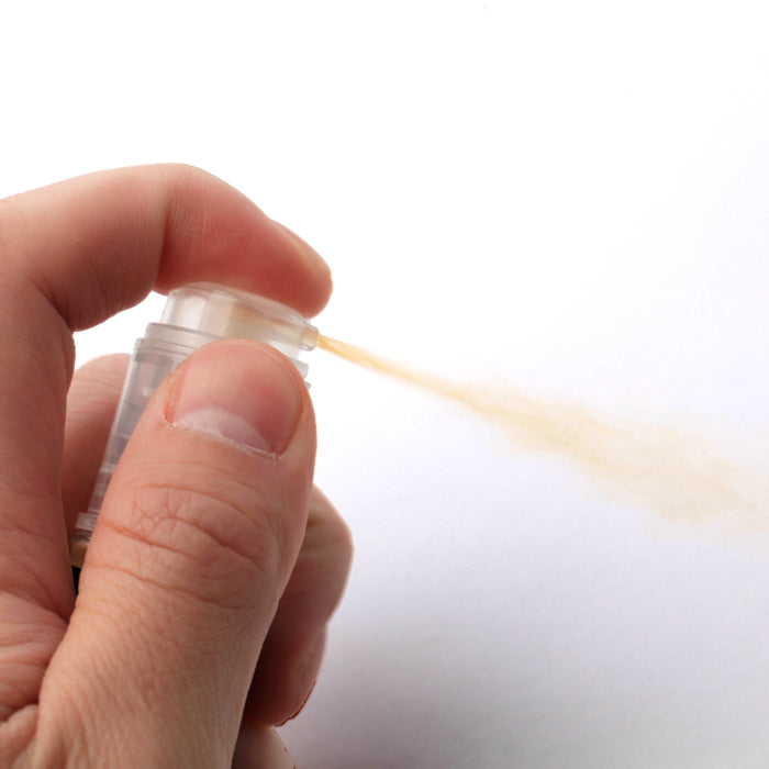 Edible luster dust pump spray applied to fondant decorations and handmade sugar flowers