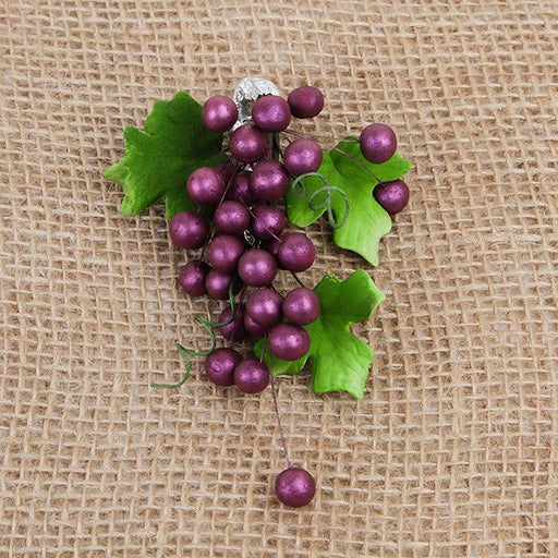 These beautiful Grape sprays in Burgundy are readymade by hand from gumpaste.  Gumpaste flowers offer a way of decorating cakes hassle free for both professional and amateur decorators.  Each spray is bound by bendable wires that make for easy positioning and application on cakes.