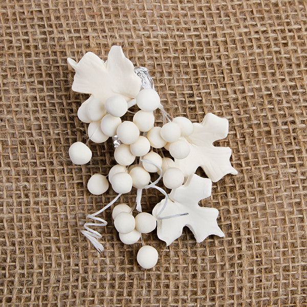 These beautiful Grape sprays in Ivory are readymade by hand from gumpaste.  Gumpaste flowers offer a way of decorating cakes hassle free for both professional and amateur decorators.  Each spray is bound by bendable wires that make for easy positioning and application on cakes.