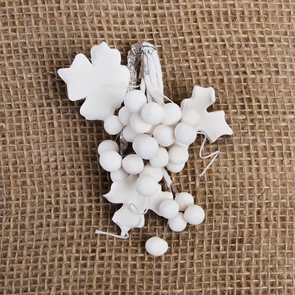 These beautiful Grape sprays in White are readymade by hand from gumpaste.  Gumpaste flowers offer a way of decorating cakes hassle free for both professional and amateur decorators.  Each spray is bound by bendable wires that make for easy positioning and application on cakes.