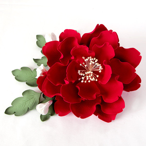 handmade gumpaste leaves with white peony buds used as sugar greenery accents for fondant and buttercream wedding cake designs