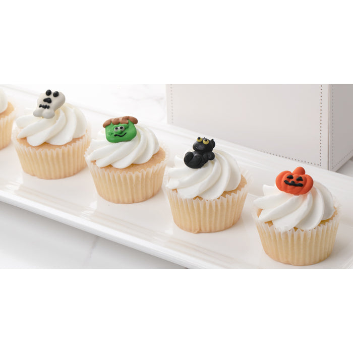 Halloween Royal Icing Toppers on cupcakes for decorating your own cupcakes, chocolates, cookies, cakes, and other desserts. Edible hand piped icing toppers ready to use on your food.