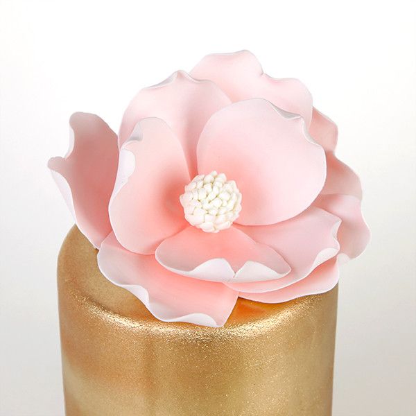 Pink Gumpaste Magnolia Cake Topper and Cake Decoration perfect for Cake Decorating rolled fondant wedding cakes and rolled fondant birthday cakes.  Wholesale bakery supplies. Cake topper