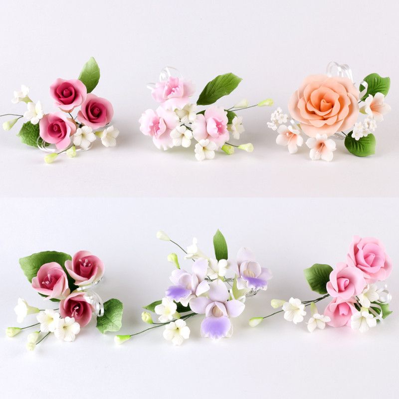 Variety of readymade gumpaste sugarflower sprays cake toppers perfect for cake decorating rolled fondant wedding cakes and fondant custom cakes.  Wholesale sugar flowers and cake decoration supply.  Cheap bargain product.