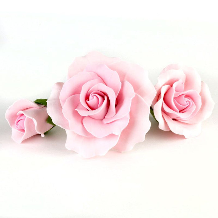 Mixed sizes of pink Gumpaste Roses handmade sugar cake decorations and cake topper perfect for rolled fondant wedding cakes and birthday cakes cake decorating. Wholesale sugarflowers and cake supply. Caljava