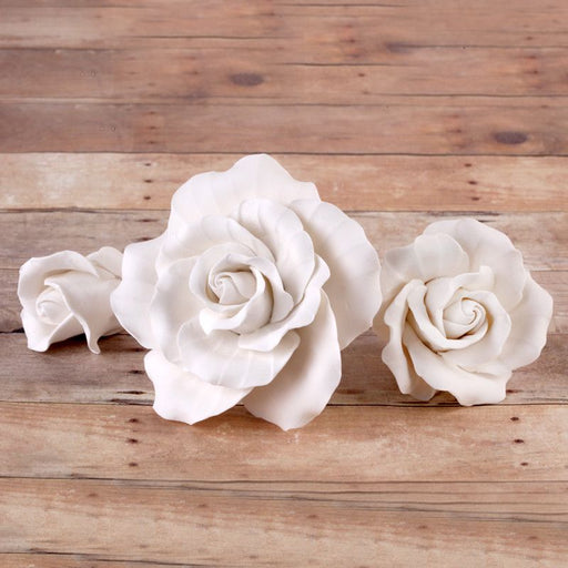 White English Gumpaste Roses handmade sugar cake decorations and cake toppers perfect for cake decorating rolled fondant wedding cakes and fondant birthday cakes.  Wholesale sugar flowers and cake supply. Caljava