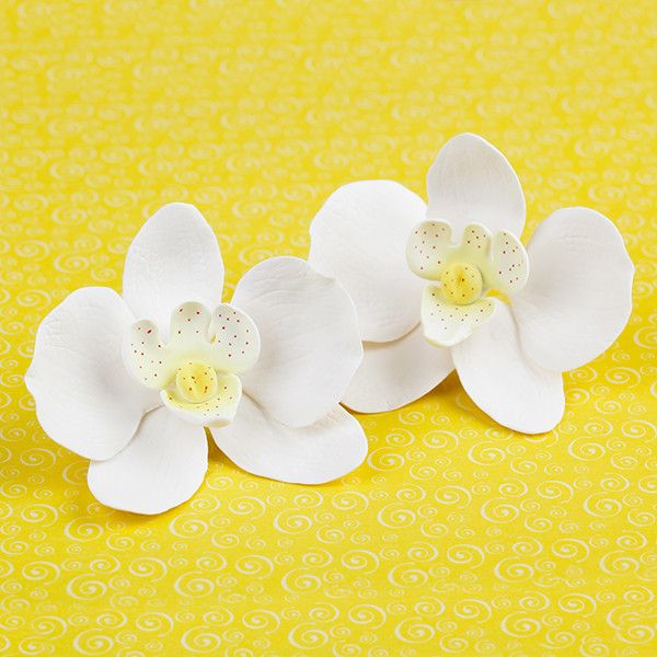 Phalaenopsis Orchids in White are gumpaste sugarflower cake decorations perfect as cake toppers for cake decorating fondant cakes and wedding cakes. Caljava wholesale cake supply.