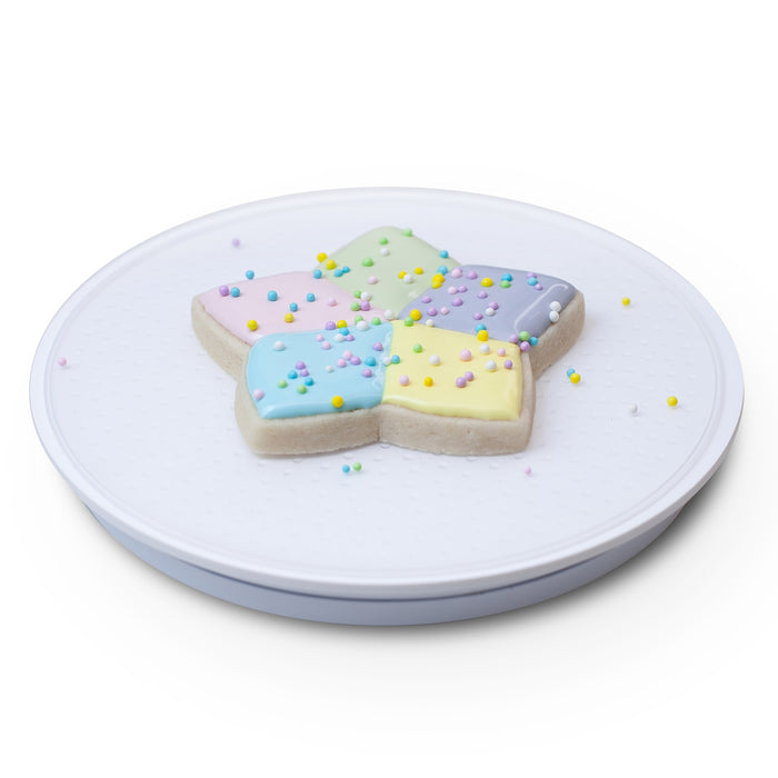 Acrylic Cookie and Cupcake Turntable makes for easy decorating.  Features a 6 inch surface with a smooth non-wobbly spin, and silicone textured surface to cold your cookie in place.  Cookie decorating tool.