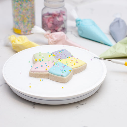 Acrylic Cookie and Cupcake Turntable makes for easy decorating.  Features a 6 inch surface with a smooth non-wobbly spin, and silicone textured surface to cold your cookie in place.  Cookie decorating tool.