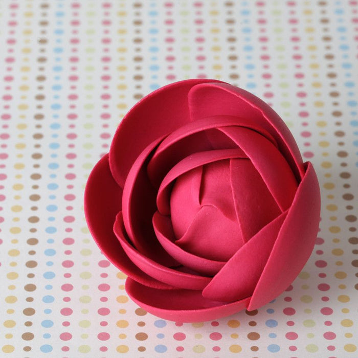 Modern pink rose sugar flowers used to decorate a tiered wedding cake from Caljava