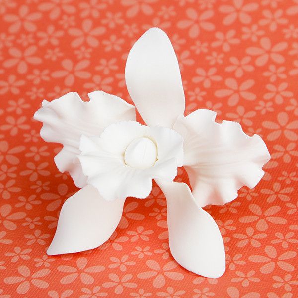 White cattleya orchid sugar flowers used on wedding cakes, 3 inch edible sugar flowers for professional cake decorators wholesale cake supply by CaljavaOnline.com