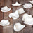 Add effortless romantic detail and delicate texture to your cake creations.

Bring soft, realistic depth to your desserts with these handcrafted White Sugar Flower Rose Petals. Sculpted from fine gumpaste with delicate, natural curves, these unwired individual petals are perfect for creating realistic scattered arrangements, cascading borders, or intricate sugar flower builds without the hassle of making petals from scratch.

Designed for maximum versatility, these fully edible petals attach easily to fonda